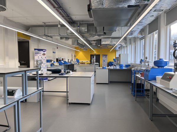 The state of the art interior of the newly refurbished Robert Blackburn Laboratory, with specialist engineering equipment and large external windows along one side of the room.