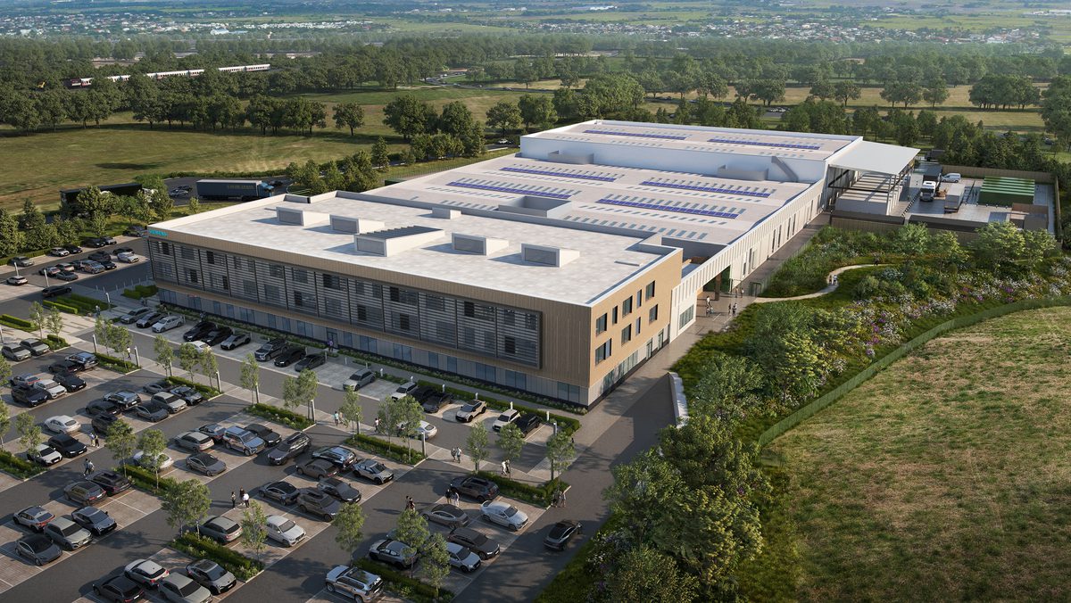 An external, aerial visualisation of Siemens manufacturing facility showing the scale of the building, associated car parking and rural surroundings.
