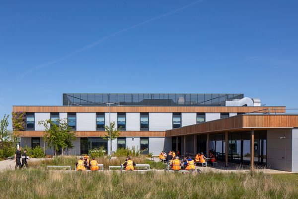 Staff enjoying the green outdoor social spaces at Siemens Mobility Train Manufacturing Facility.