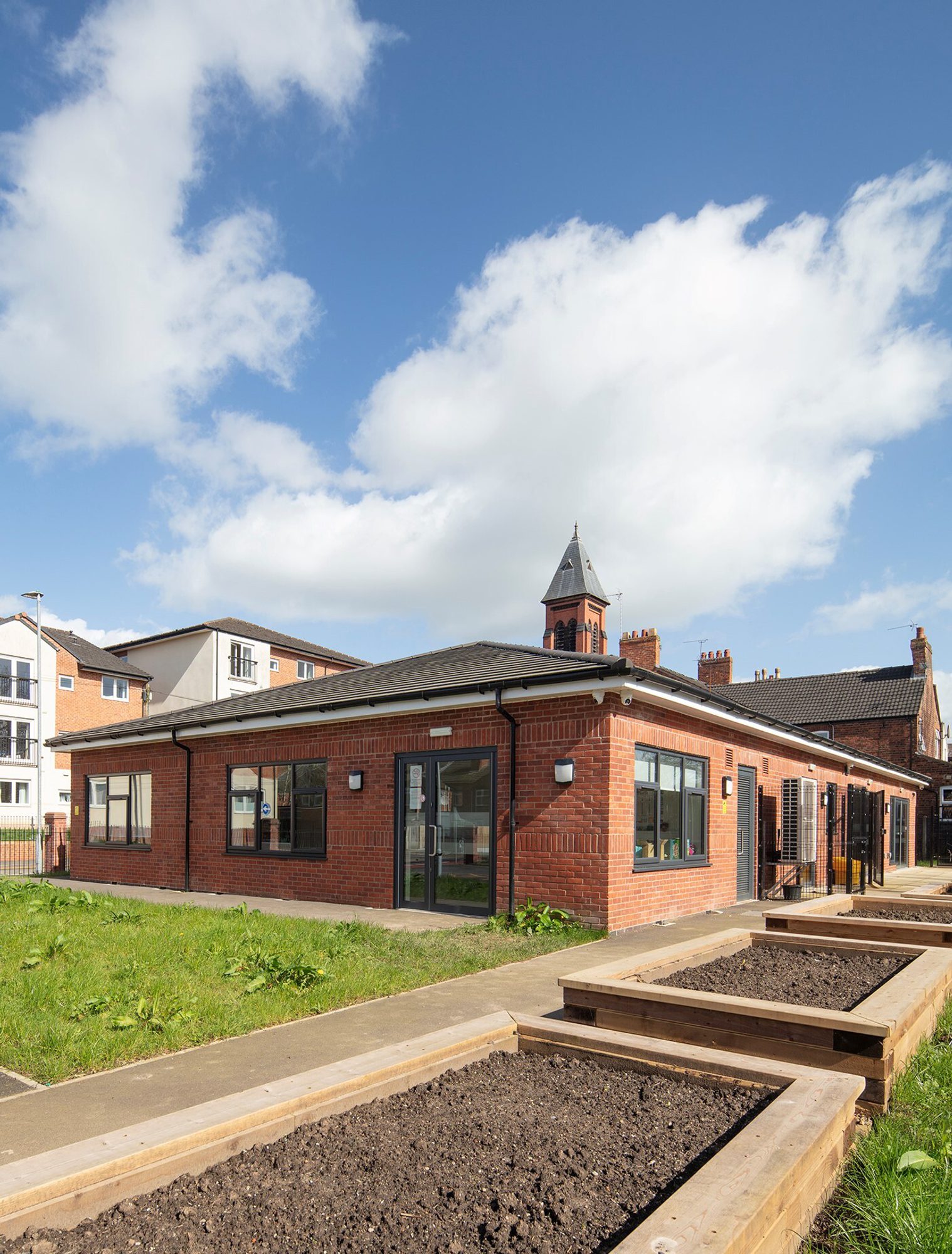 Flower beds will brighten the outdoor space