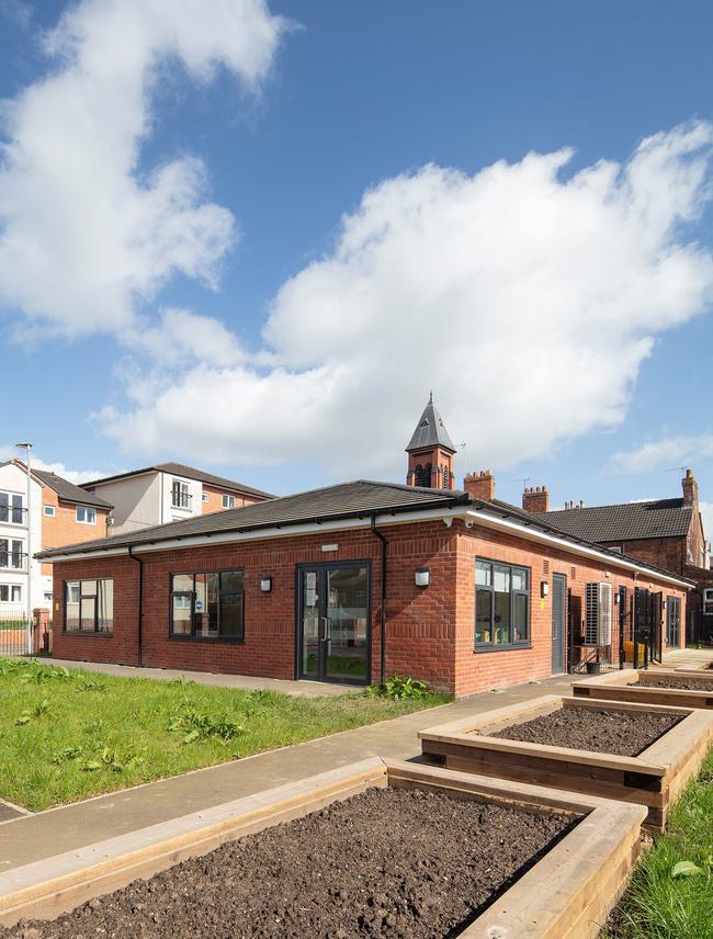 Flower beds will brighten the outdoor space