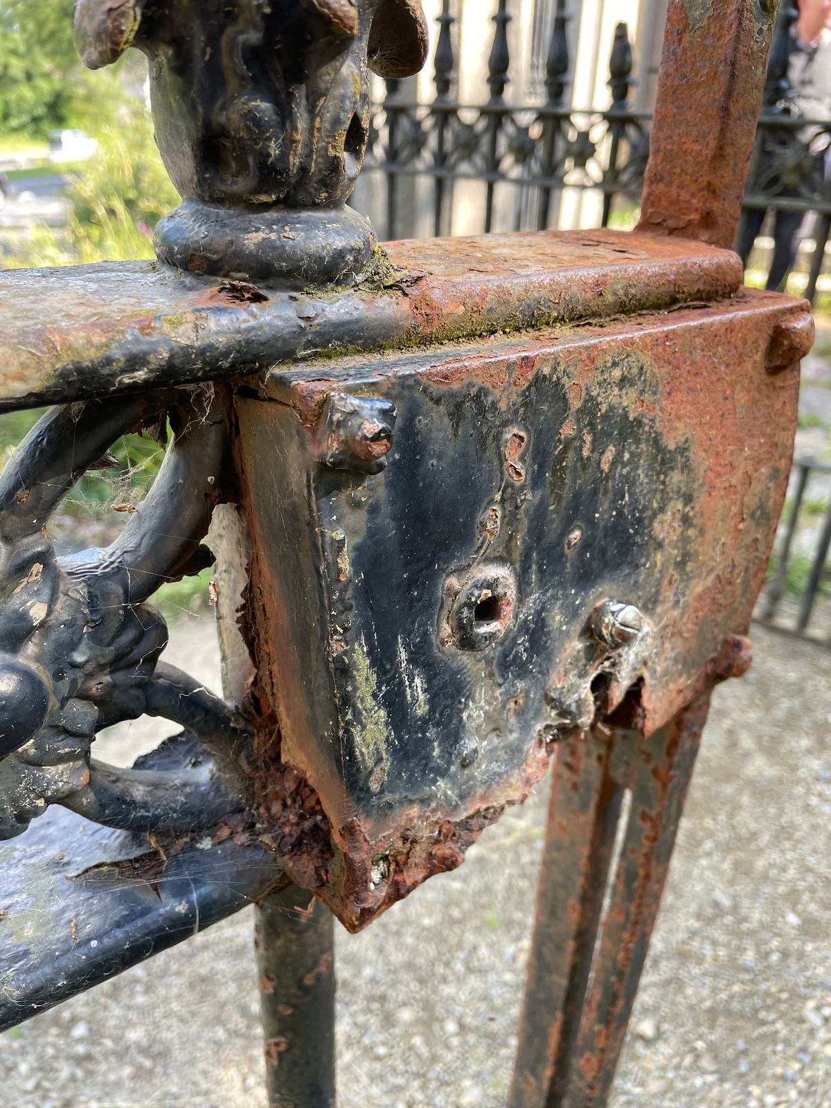 The iron gates are showing signs of corrosion 3000px