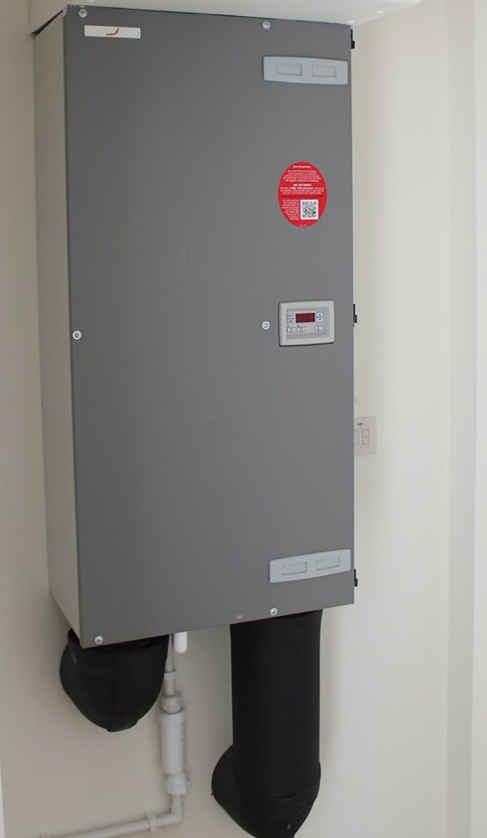 One of the Passivhaus certified Mechanical Ventilation with Heat Recovery units, located externally on each of the houses within the Pheasantry residential development.