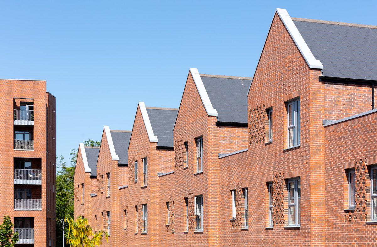An exterior detail shot showing the gabled rooves and red brick facade of The Ridgeway housing development.