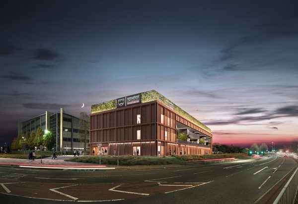 An exterior visualisation of the Thrive Health and Wellbeing Centre showing project's central location at night.