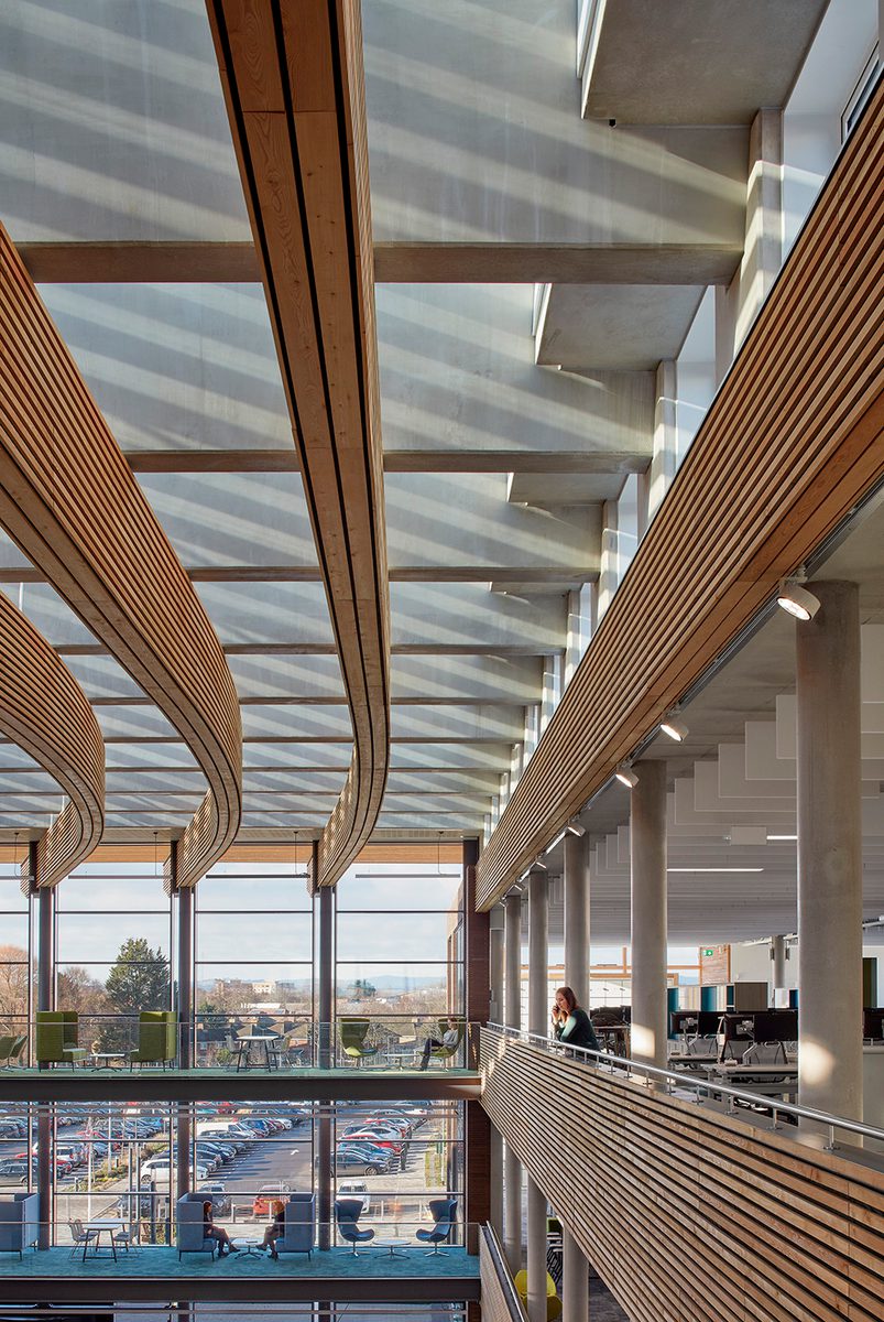 An interior detail shot of the timber baffles and cladding and glazed roof within the UK Hydrographic Office.