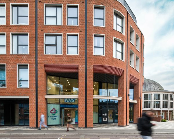 The entrance to the health and wellbeing centre at Victoria Square, with nearby heritage buildings in the background.