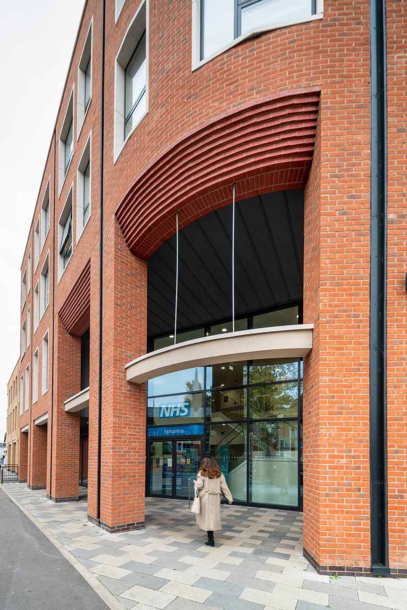 The redbrick entrance, with double height windows of Livewell Hub entrance at Victoria Square.