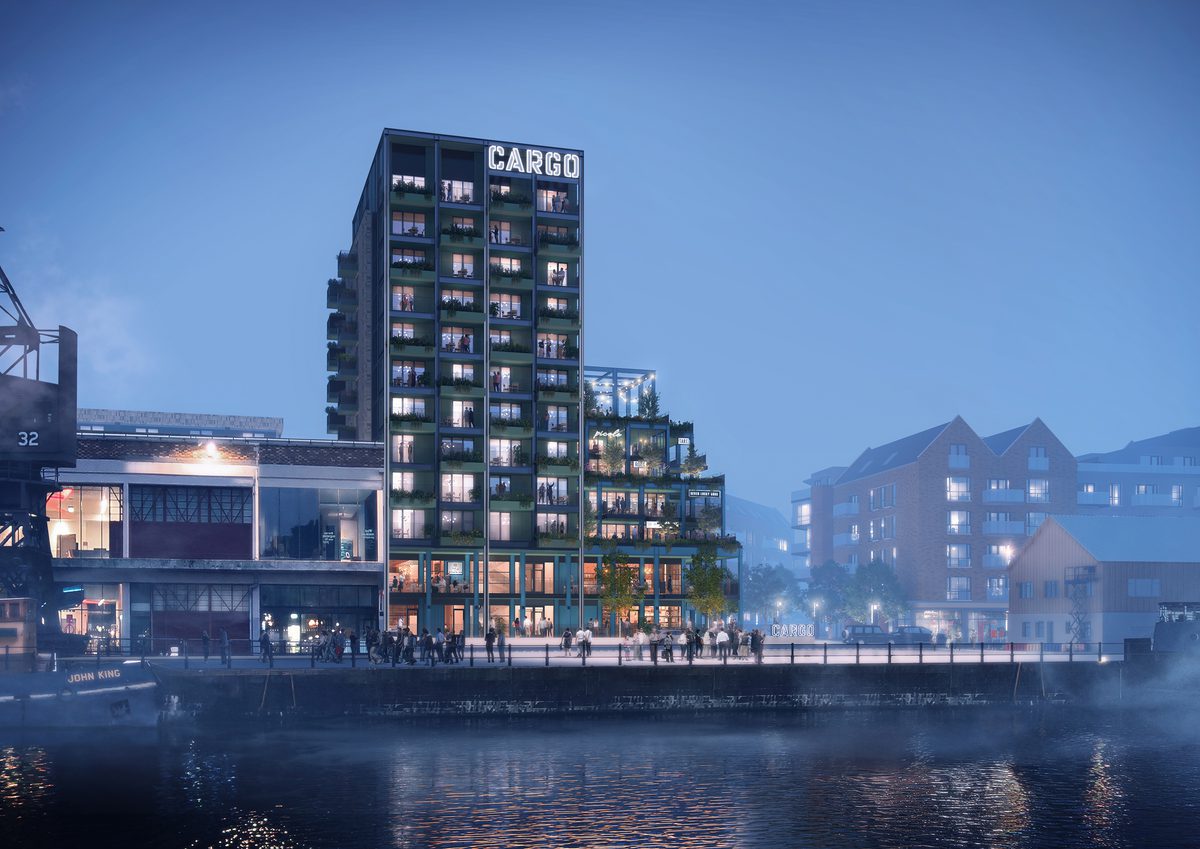 A visualisation of the Wapping Wharf North development at dusk showing the scale of the retail podium sitting in its harbourside setting.