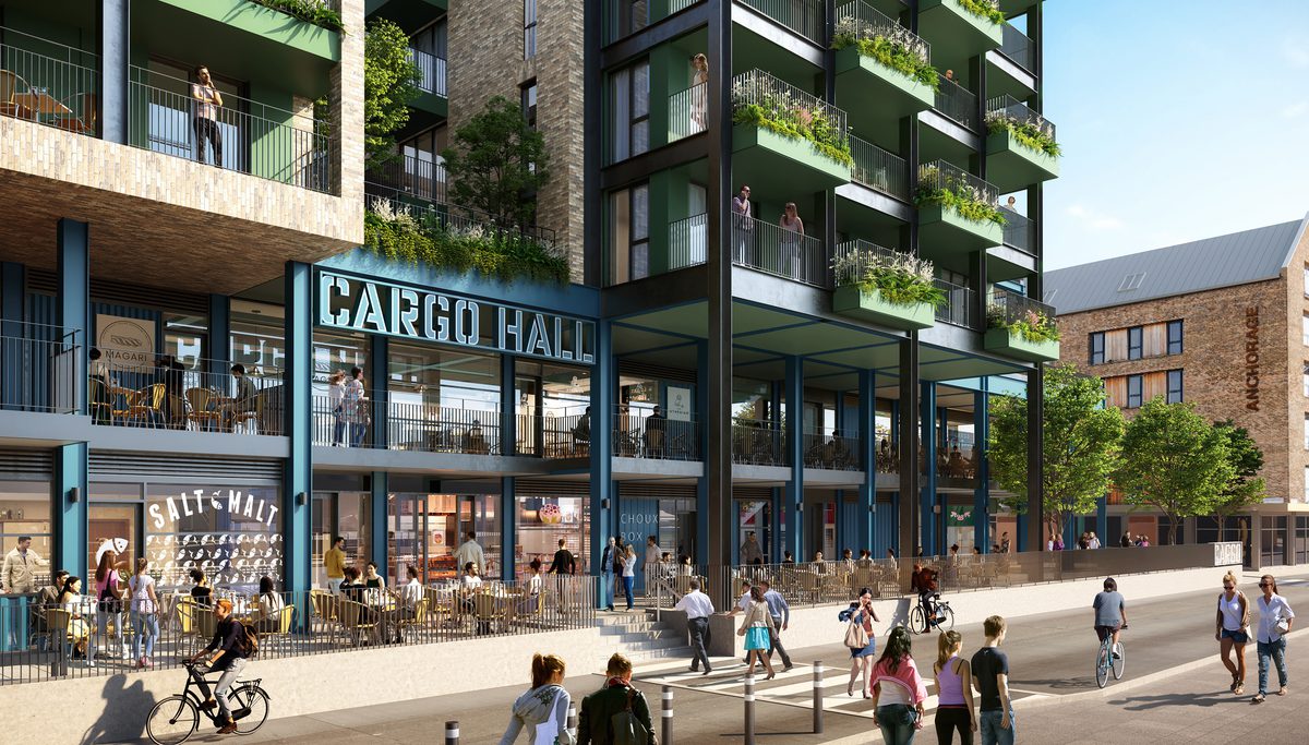A visualisation of the cargo hall within the Wapping Wharf development highlighting the steel framing elements, food and beverage units on the ground level and residential spaces on the first floor.